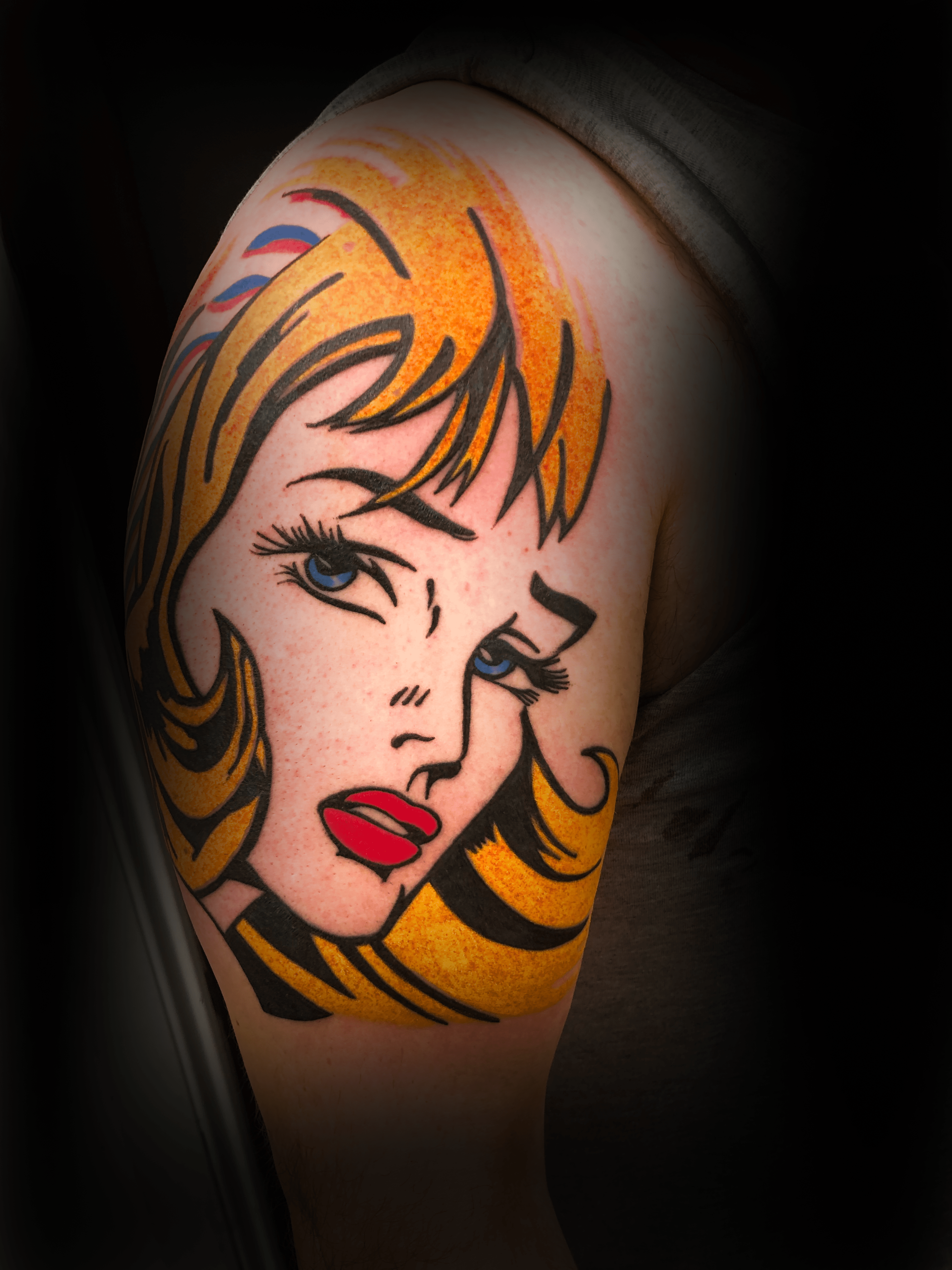 An image of a custom tattoo from Kevin Younger's Lucky Cat Tattoo Parlour: a design featuring a colourful retro cartoon style female character